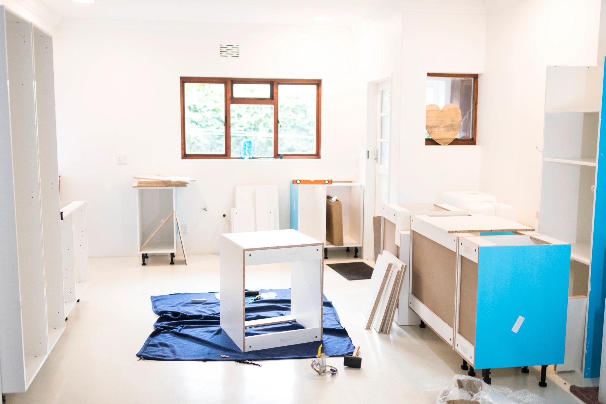 Kitchen cabinets being installed during remodel