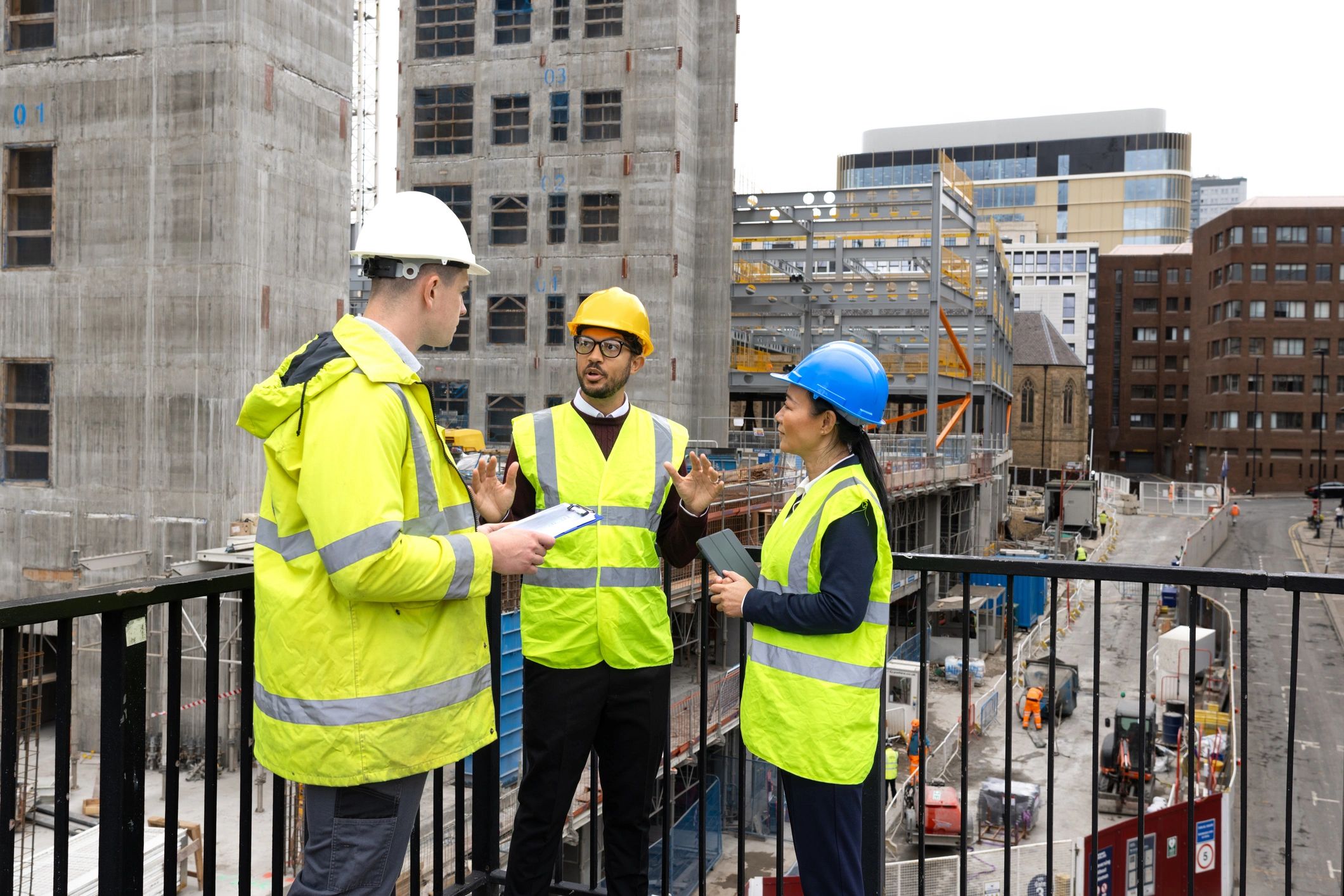 Construction team reviewing plans for a home improvement project